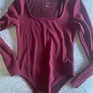 a new day Wine/Burgundy Long Sleeve Bodysuit. Snap.